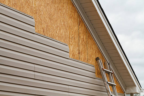 Professional Siding Replacement technician working in Cable, OH